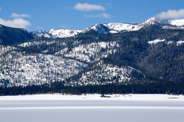 Snow-covered mountains above the water near Cascade and McCall, Idaho in winter